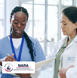 Three medical professional women conferring and looking over papers